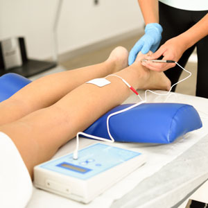 Woman having electro acupuncture