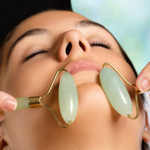 Woman having face treatment